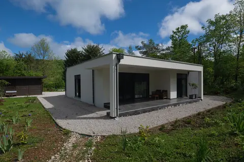 Maison passive 100 m² en 2026 : le vrai budget clé en main, ventilation et aides