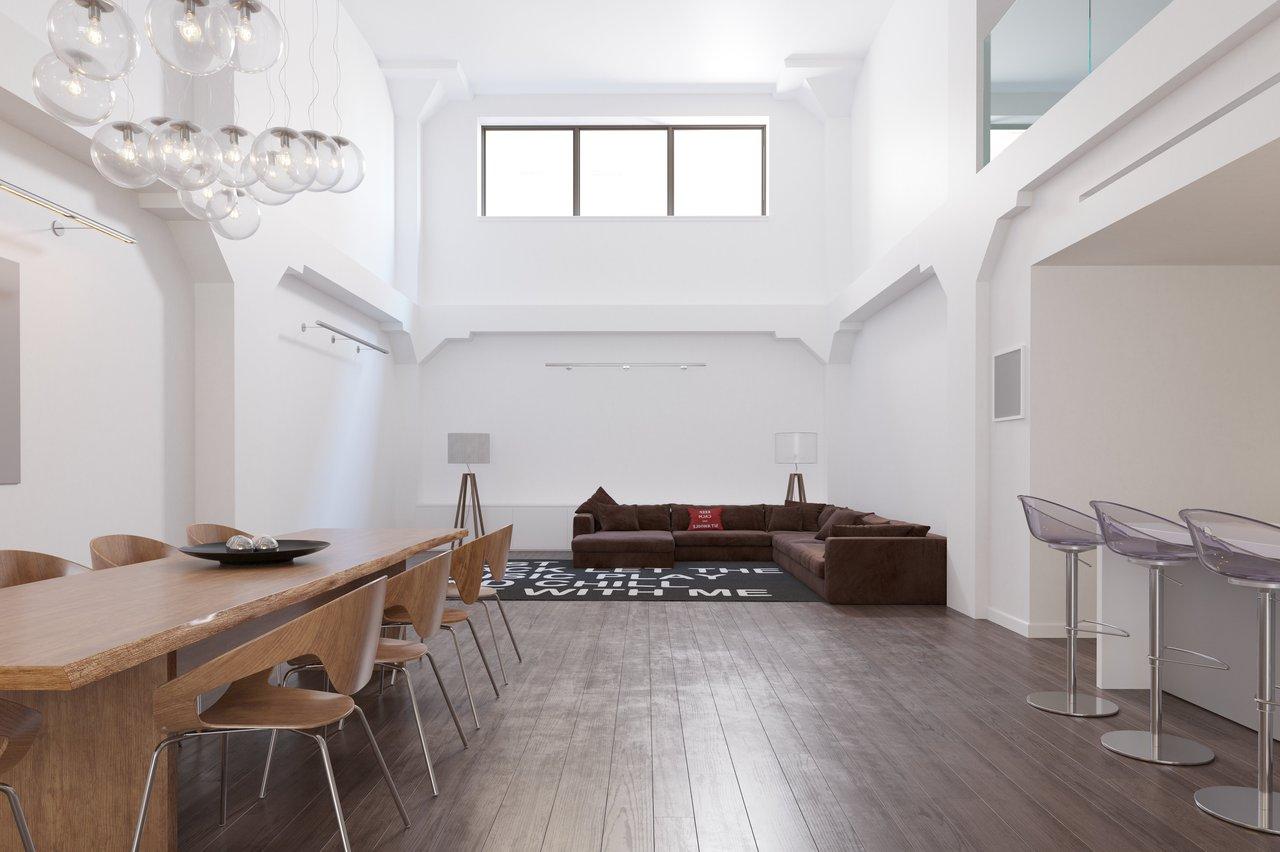 Aménagement d’un salon moderne avec mobilier bas, séparateurs semi-ouverts et éclairage en couches.